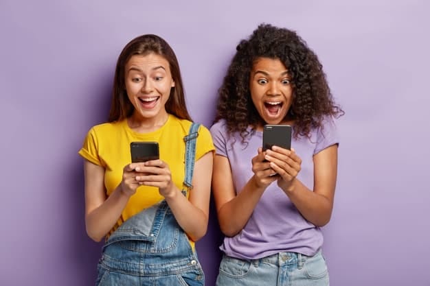 Two young excited woman to be recieving a phone call with CallApp