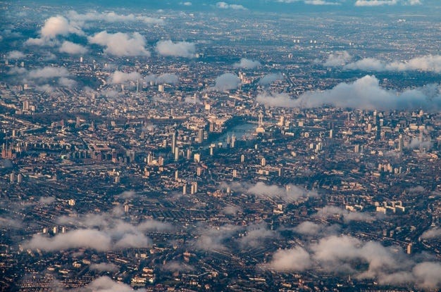 An aerial photo of central London amid clouds
