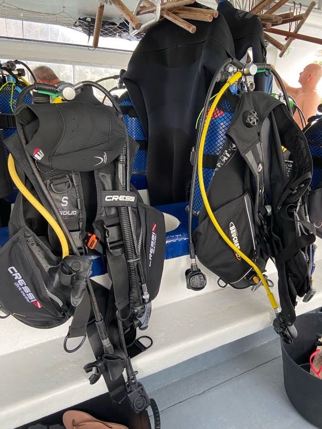 2 sets of ready dive equipment in a boat