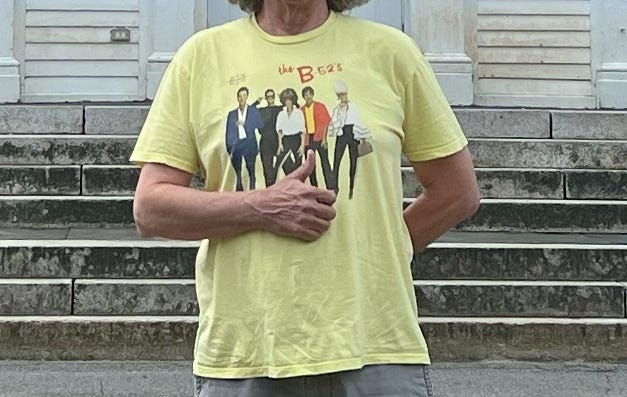 The author with a yellow t-shirt.