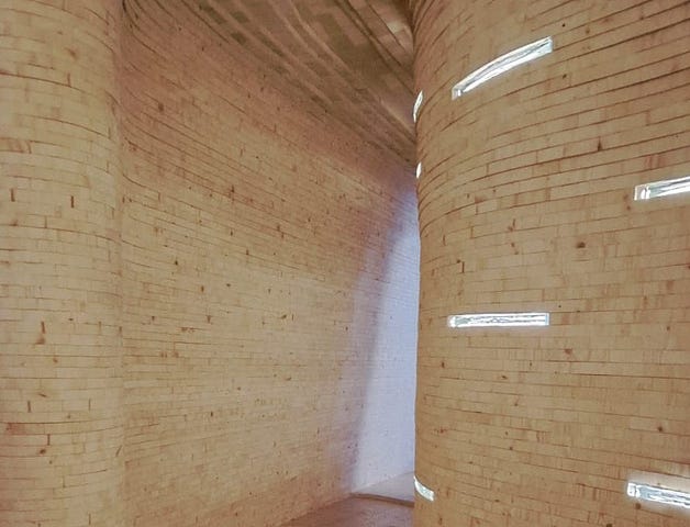 An abstract brick tunnel with unequal dimensions and random rectangular lights