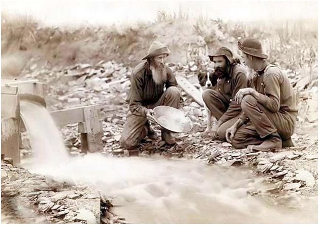 Antique photo of a group of gold panners, panning for… recruits