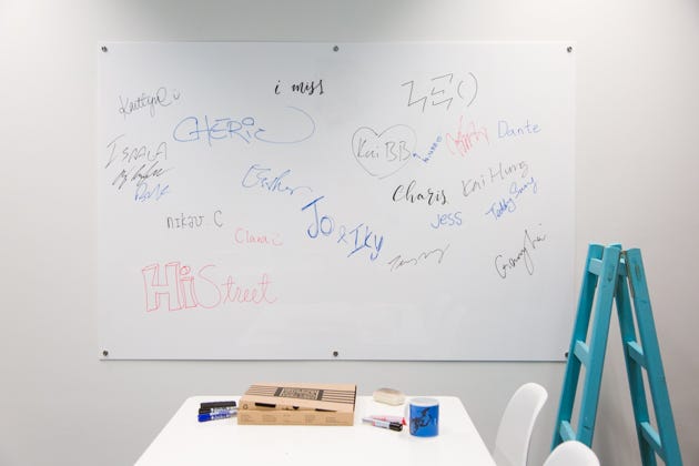 Signed acrylic whiteboard at startup HiStreet Hong Kong office