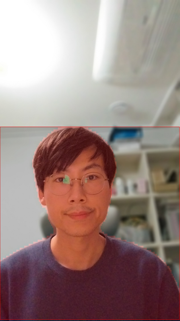 A portrait of a man with glasses looking directly at the camera, with a soft-focused interior background. The image showcases a potential subject for testing yolov8 segmentation in c#.
