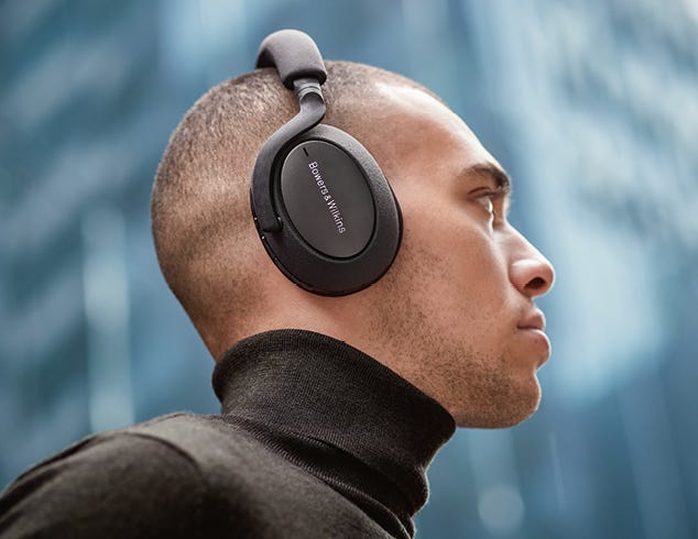 A photo of a man in profile wearing headphones.