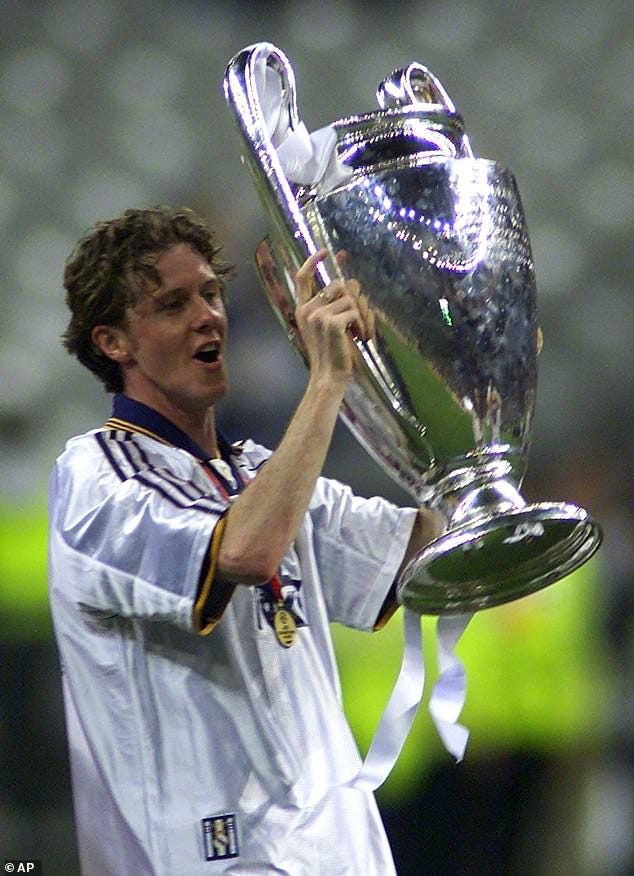Real Madrid’s Steve McManaman lifts the Champions League trophy