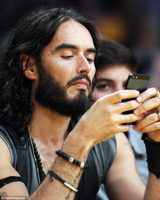 Russell Brand using the iPhone 5