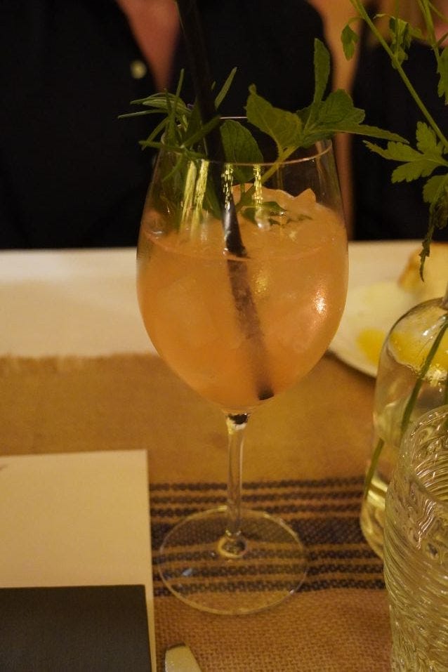 Rich Riviera in a wine glass with ice, lavender, and thyme at Summer of Ludo & Gilles Montage Beverly Hills