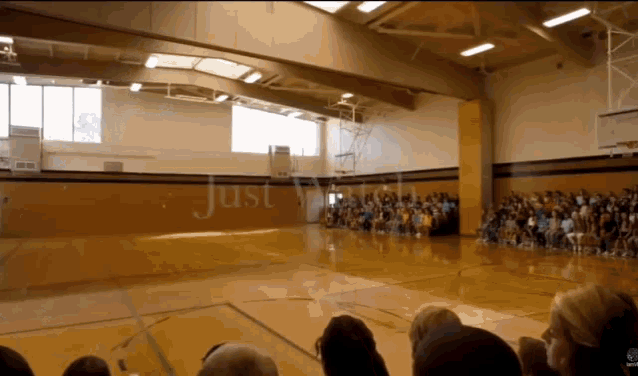 Massive digital humpack whale jumping up from the floor of a gymnasium. Credit Magic Leap