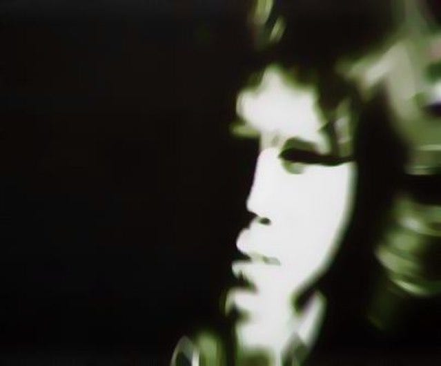 Photograph: Nick Drake’s face posterized in grayscale with one side blacked out by shadow.