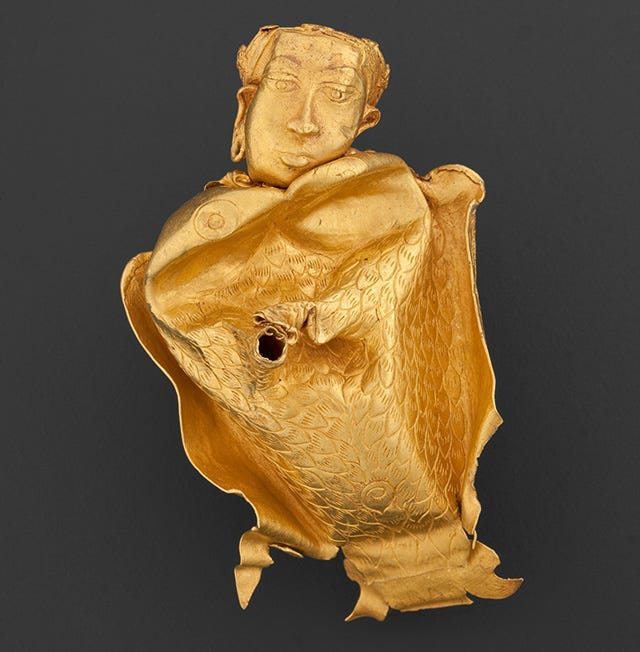 A golden statue of the goddess kinnari