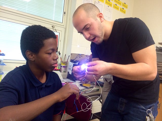 Artist-Educator Ben Horvat working on a circuit with a student at Hannah Gibbons STEM School during a recent residency project.