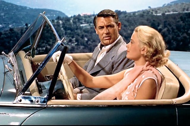 Cary Grant and Grace Kelly in a car