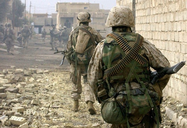 U.S. Marines patrolling the streets of Fallujah, Iraq, in December 2004.