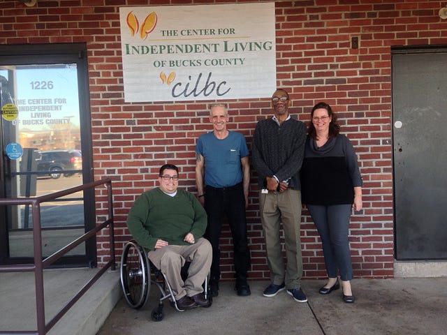 The support team: Pictured are (from left) Josh Pittinger, executive director of the Center for Independent Living of Bucks County; Brian Tanner; Allen Johnson, a recovery coach with the Mental Health Association of Southeastern Pennsylvania’s Host Program; and Karen Hewlett, program manager at the Center for Independent Living. TIMOTHY REILLY / FOR THE TIMES