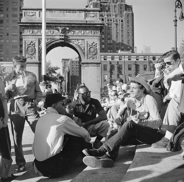 People listening to folk singer Ramblin’ Jack Elliott on a Sunday afternoon in Washington Square, Greenwich Village, 1955.