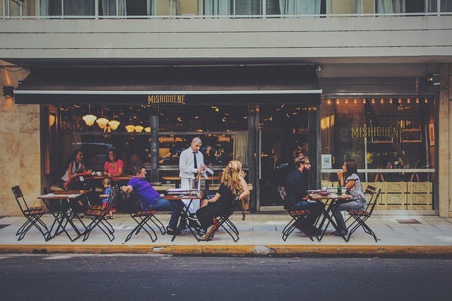 Customers outside of a bar