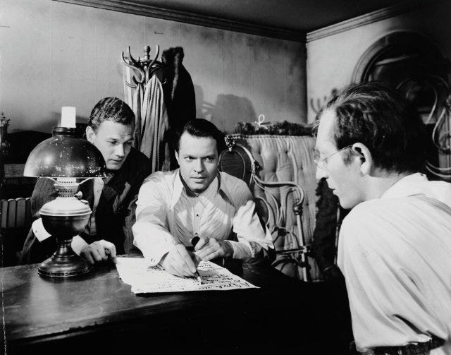 Cotten, Welles, and Sloane putting together their first edition of The Inquirer 