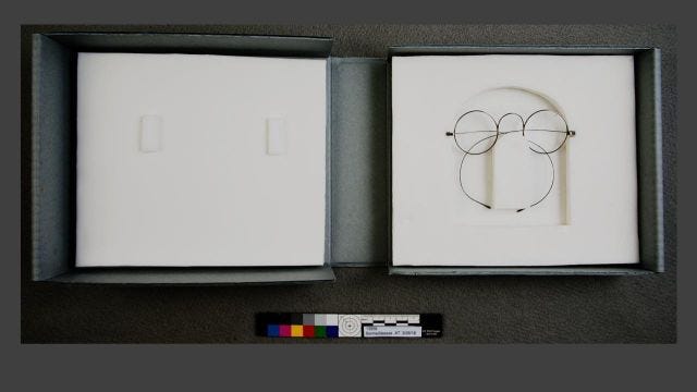 a folding enclosure that is custom built to house a pair of wire-framed glasses