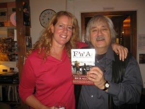 Katrina Hammond and Rick Allen's friend, Herbert, in Holland. Both are holding a copy of Allen's book, 'F 'n' A! My Crazy Life in Rock and Blues.'
