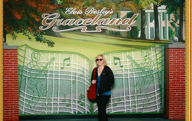 Angel La Canfora standing in front of the gates of Elvis Presley’s Graceland