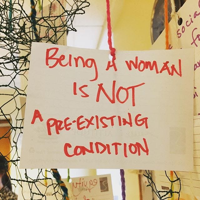 Image: being a woman is not a pre-existing condition