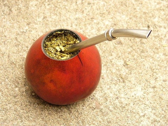 Yerba mate in a calabaza gourd with a bombilla.