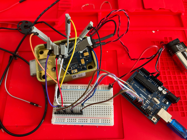 The lock connected to a breadboard and an Arduino