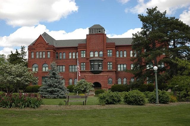 Large old brick university building.