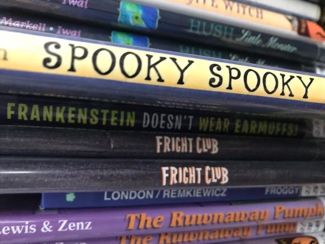 Photo of book binding that reads “SPOOKY SPOOKY”