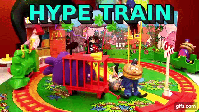 Robot Chicken action figure of Ronald McDonald the clown riding in circles on a track, with the words “HYPE TRAIN” flashing