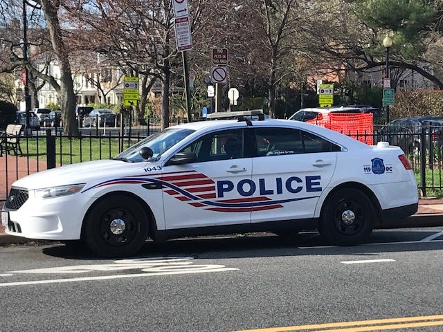 Photo of police car parked on the street