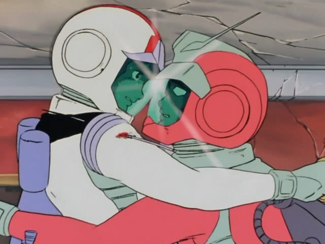 A screencap from Mobile Suit Gundam 0079, depicting Char Aznable and Amuro Ray fighting in spacesuits. They’re chest to chest, their visors touching.