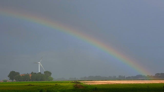 Wind generator under a rainbow.