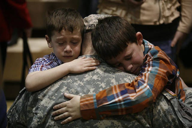 A soldier leaving his children to go to war