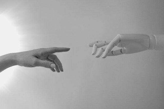 Robot hand reaching for human hand