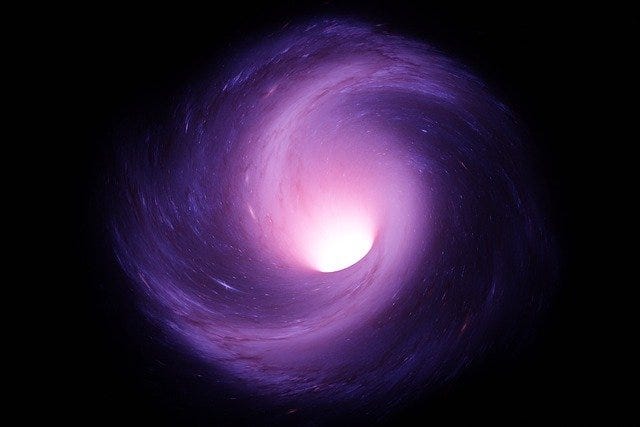 What is worm hole in space what causes a wormhole in space