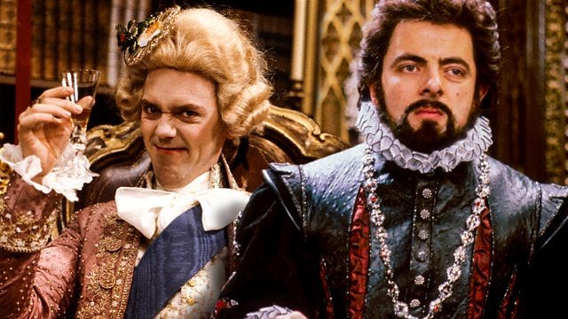 Two men dressed in Jacobean clothing, one holding a champagne flute and pulling a funny face and the other looking unamused