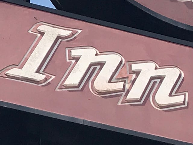 Photo of awning that reads “Inn”