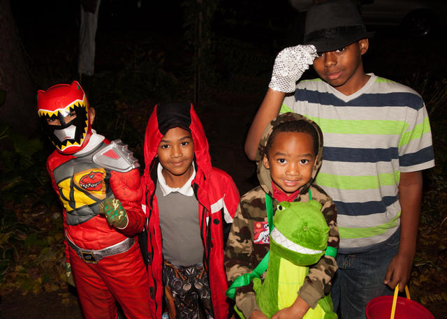 cute african american kids dressed in Halloween costumes out trick or treating; for Dr. Croom Army Vet’s blog post