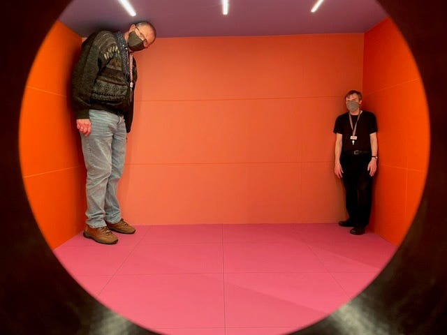 An Ames Room, where people appear very different heights