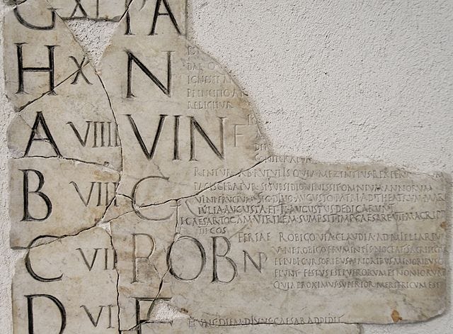 A fragment of the Fasti Praenestini for the month of April (Aprilis), showing its nundinal letters on the left side