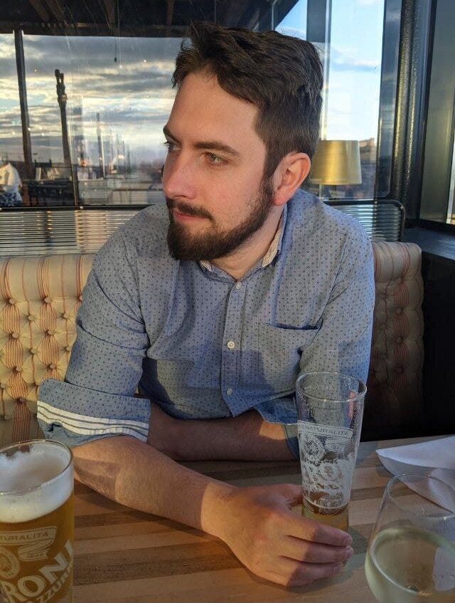 Sean Winters sitting with a beer at Sophie’s Rooftop Restaurant in Dublin