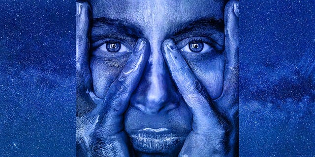 Man touching his face, abstract portrait, man facial expression while touching his face in blue background