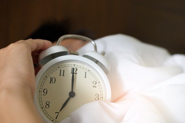 a clock in amongst the sheets.