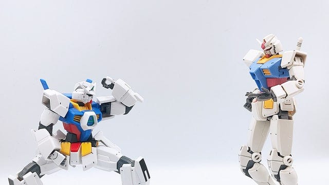 Two toy Japanese robots get ready to fight.