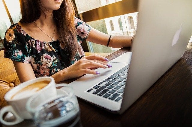 Photo of woman working at a laptop