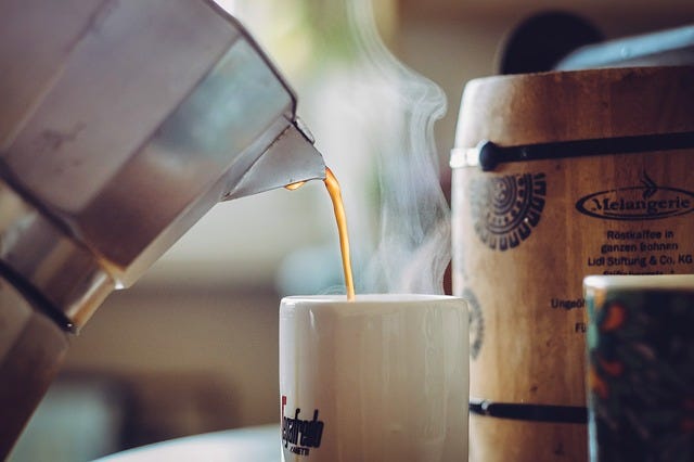 Coffee being poured into a cup