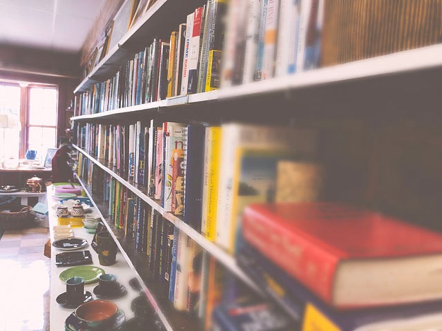 Shelves of books in a quaint New England thrift store.