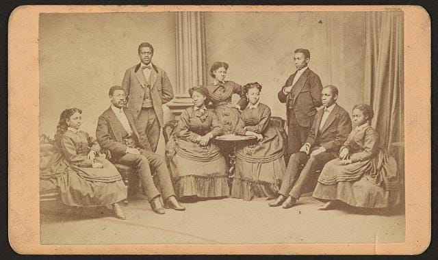 An antique image slide of the all-Black Fisk University Jubilee Singers taken between 1870 and 1880.
